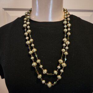 Long necklace with gold-tone metal beads and simulated pearls